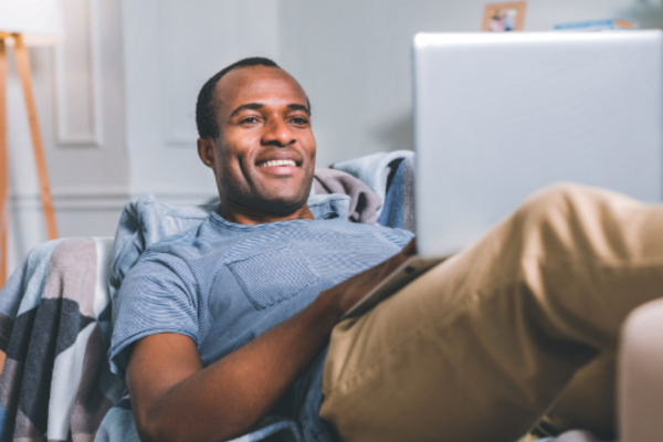 Relaxed man working at home